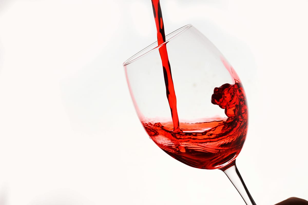 Wine being poured into a glass.