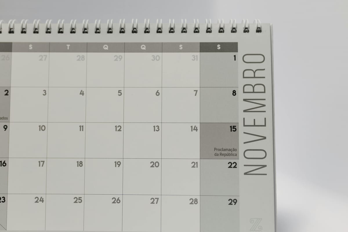 A simple wall calendar in a home kitchen.