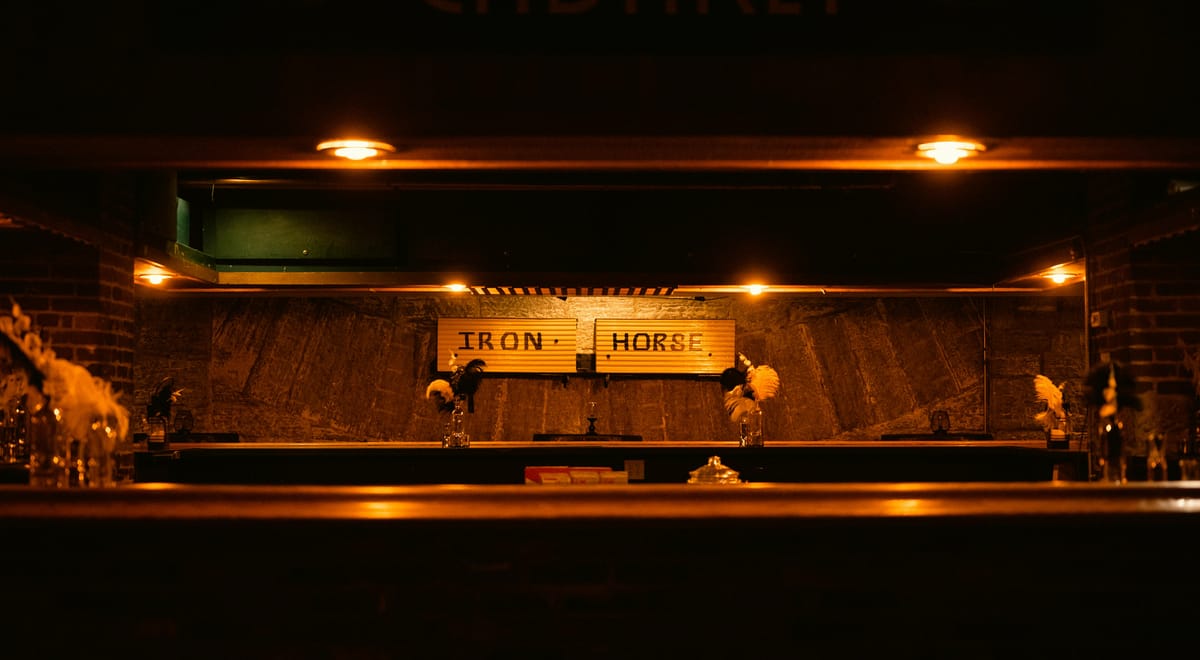 A pub interior in soft evening light.