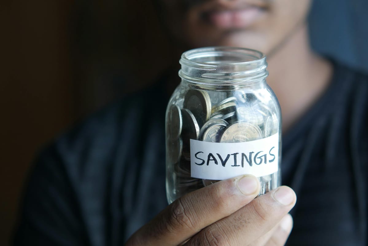 A savings jar in soft natural light.