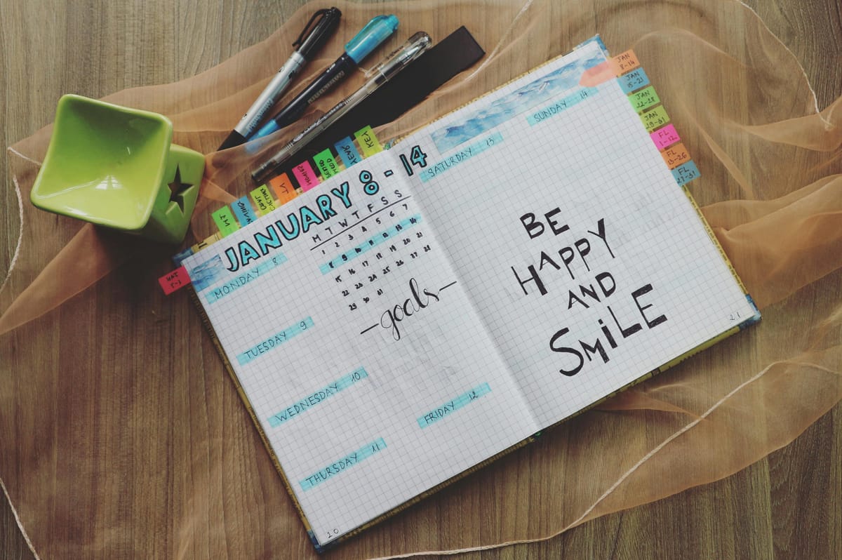 A weekly planner with handwritten notes.