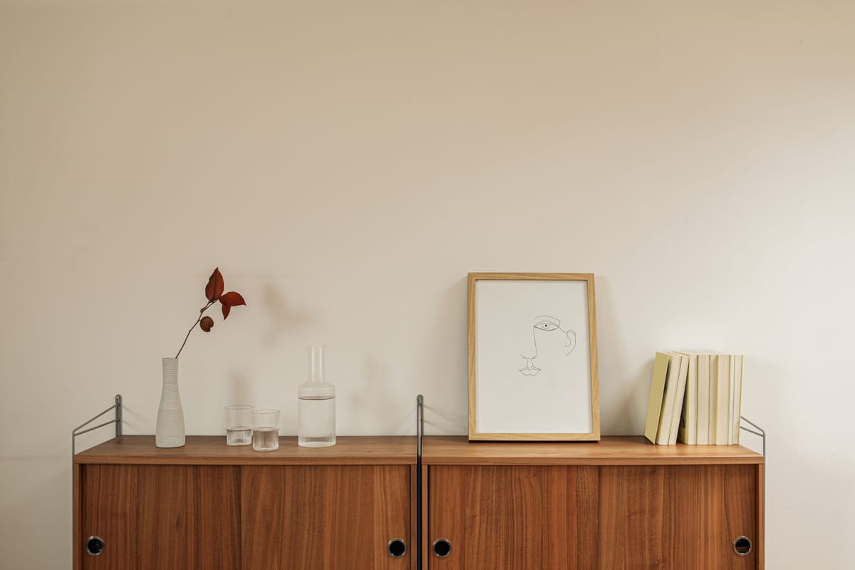 A nearly empty shelf holding a single folder.