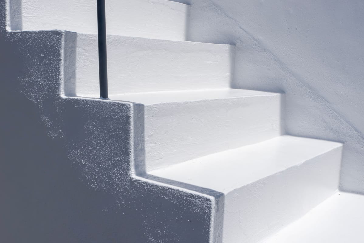 A simple staircase ascending in soft light.