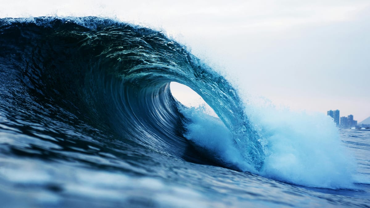 A close-up of a single wave breaking.