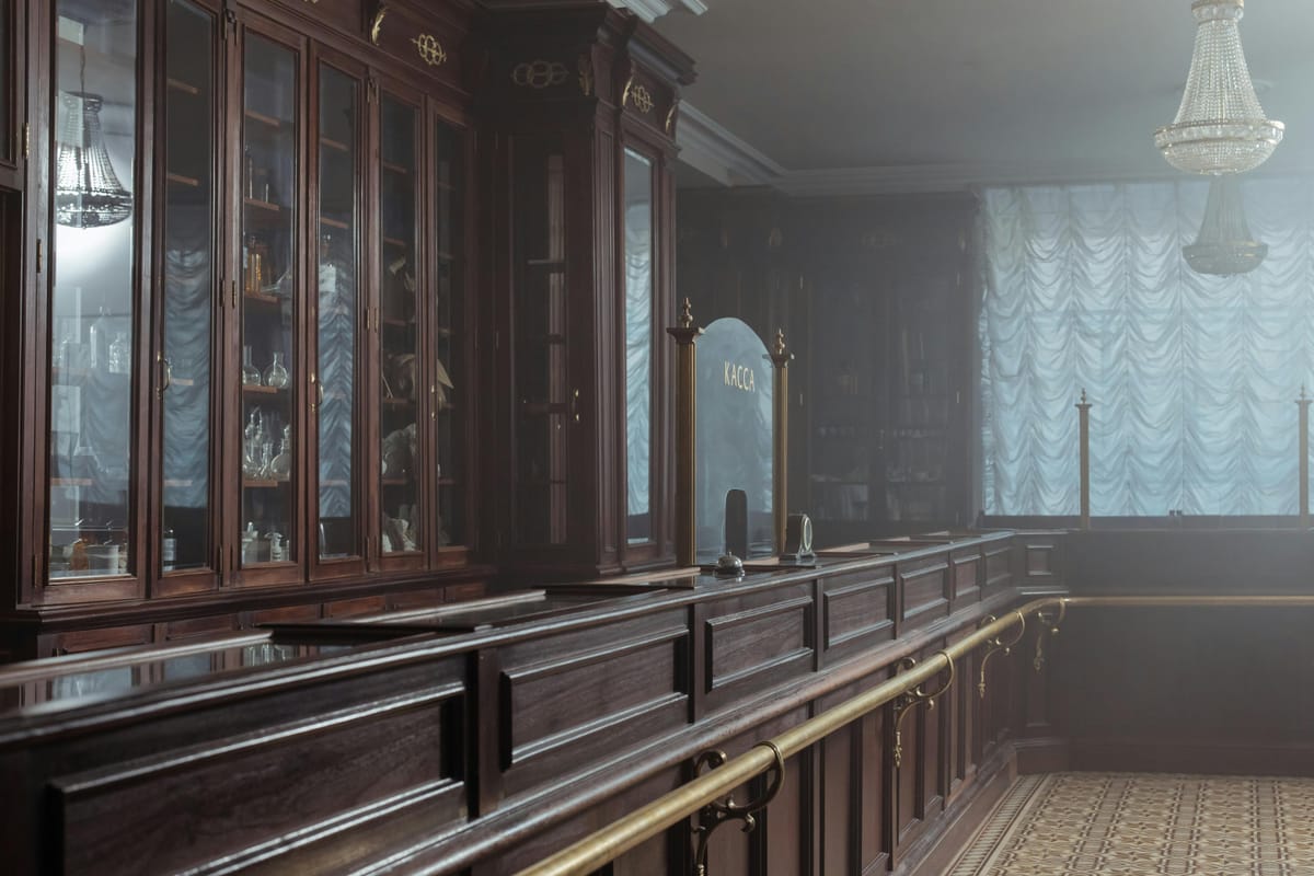 A modern pharmacy interior with shelves and a clean counter.