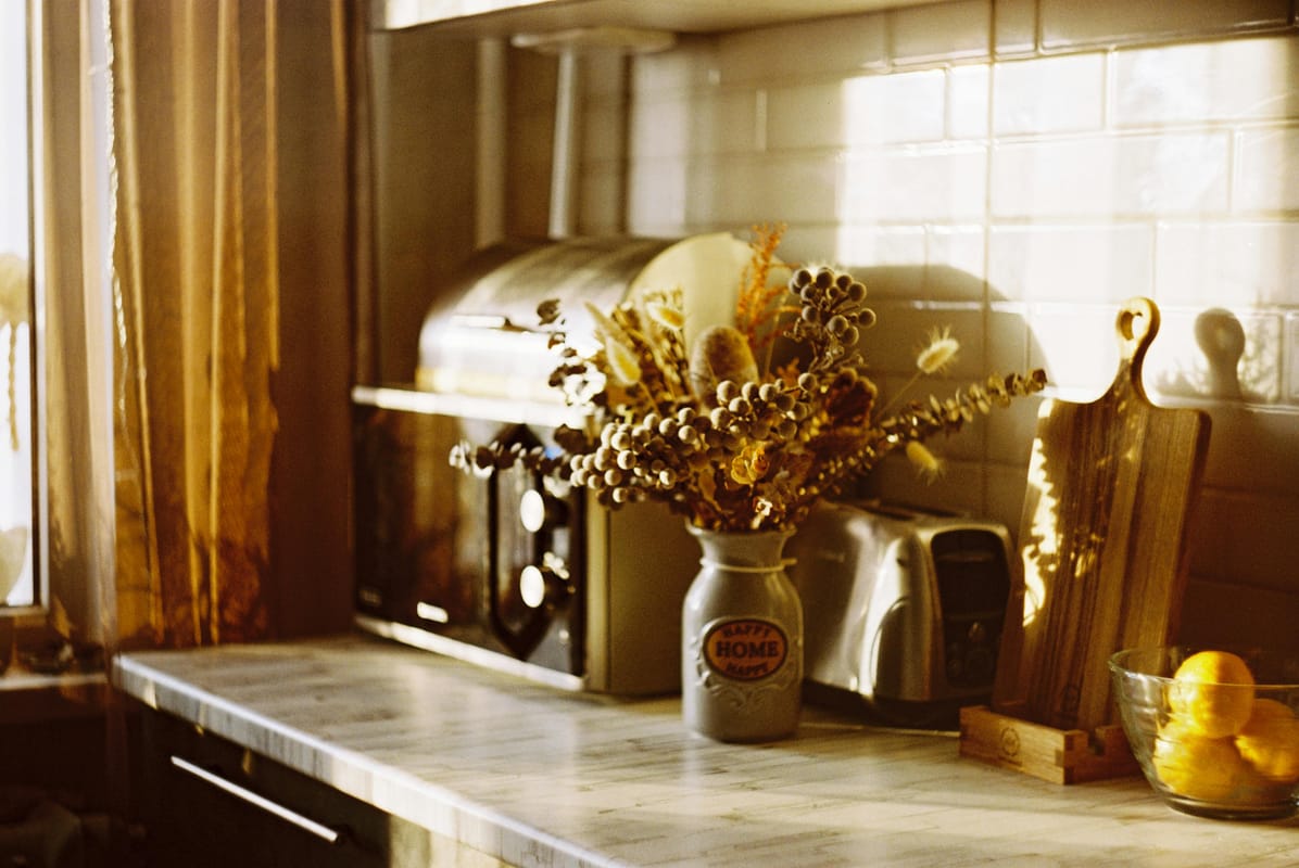 A calm home kitchen interior in morning light.