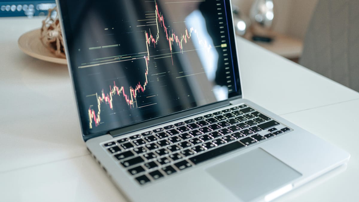 A laptop screen showing a simple line chart, suggesting trend analysis.